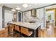 Spacious kitchen with a large center island, stylish countertops, and modern appliances at 120 Mearleaf Pl, Holly Springs, NC 27540