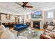 Inviting living room featuring a fireplace, plush seating, and an open floor plan at 120 Mearleaf Pl, Holly Springs, NC 27540