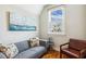 Comfortable living room with a sofa, accent chair, and window with natural light at 120 Mearleaf Pl, Holly Springs, NC 27540