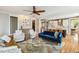 Cozy living room showcases hardwood flooring, comfortable seating, and an open floor plan design at 120 Mearleaf Pl, Holly Springs, NC 27540