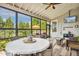 Enclosed patio with a view featuring comfortable seating and stylish decor at 120 Mearleaf Pl, Holly Springs, NC 27540