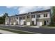 New townhomes with garages and neutral color schemes offer a modern and appealing street presence at 121 N Chubb Rdg, Wilson's Mills, NC 27520