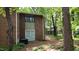 Backyard view features a partially shaded patio area and mature trees at 1222 Teakwood Pl, Raleigh, NC 27606