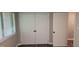 Bedroom featuring wood floor, window and closets with new doors at 1222 Teakwood Pl, Raleigh, NC 27606