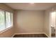 Bedroom with a window view, updated flooring and neutral color paint at 1222 Teakwood Pl, Raleigh, NC 27606