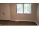 Comfortable bedroom with a large window and closet at 1222 Teakwood Pl, Raleigh, NC 27606