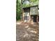Two-story home with a combination of brick and green siding, surrounded by mature trees at 1222 Teakwood Pl, Raleigh, NC 27606