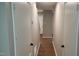The hallway features modern flooring that leads to the front of the home at 1222 Teakwood Pl, Raleigh, NC 27606