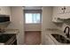 Well-lit kitchen featuring granite countertops, stainless steel appliances, and modern white cabinetry at 1222 Teakwood Pl, Raleigh, NC 27606