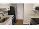 Modern kitchen with stainless steel appliances, granite countertops, and white cabinets at 1222 Teakwood Pl, Raleigh, NC 27606