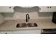Close up view of kitchen sink with stainless steel sink and black faucet at 1222 Teakwood Pl, Raleigh, NC 27606