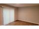 Bright living room with sliding glass doors and window blinds and vinyl floors at 1222 Teakwood Pl, Raleigh, NC 27606