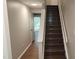 Well-lit staircase with wood stairs at 1222 Teakwood Pl, Raleigh, NC 27606