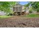 Exterior shot showing the screened-in back porch and the supporting beams in the backyard at 13017 Townfield Dr, Raleigh, NC 27614