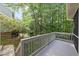 View of the back deck showing the wood flooring and the railing around the deck at 13017 Townfield Dr, Raleigh, NC 27614