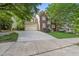 Inviting two-story home with a combination brick and siding exterior, showcasing a well-maintained front yard at 13017 Townfield Dr, Raleigh, NC 27614