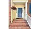 Close-up view of a welcoming front door with a decorative wreath, framed by brick steps and white railings at 13017 Townfield Dr, Raleigh, NC 27614