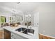 Bright, open-concept kitchen with stone countertops and stainless steel appliances at 13017 Townfield Dr, Raleigh, NC 27614
