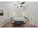 Relaxing main bedroom features vaulted ceiling, ceiling fan, and rug over beautiful wood floors at 13017 Townfield Dr, Raleigh, NC 27614
