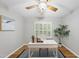 Bright home office with a white desk, ceiling fan, and ample natural light at 13017 Townfield Dr, Raleigh, NC 27614