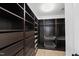 Spacious walk-in closet with built-in shelving and drawer units for optimal organization at 13017 Townfield Dr, Raleigh, NC 27614