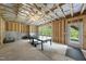 Unfinished basement with exposed framing, insulation, and ping pong table at 1309 Magnolia Gln Cir, Wake Forest, NC 27587