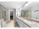 Bathroom featuring a soaking tub, glass shower, granite counters, and double sinks at 1309 Magnolia Gln Cir, Wake Forest, NC 27587