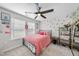Bedroom featuring a cozy bed, shelf, natural light, and decorative cherry wallpaper at 1309 Magnolia Gln Cir, Wake Forest, NC 27587