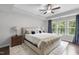 Large main bedroom features natural light, tray ceiling, wood floors, and decorative accents at 1309 Magnolia Gln Cir, Wake Forest, NC 27587