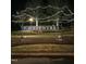 Illuminated Hasentree community sign at night, surrounded by well-maintained landscaping and decorative lighting at 1309 Magnolia Gln Cir, Wake Forest, NC 27587