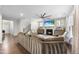 Open living room showcasing hardwood floors, a cozy fireplace, and ample seating at 1309 Magnolia Gln Cir, Wake Forest, NC 27587