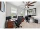 Home office with two work stations, each with a desk and office chair; large window at 1309 Magnolia Gln Cir, Wake Forest, NC 27587