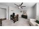 Well-lit office with gray carpet, desk, seating area, and storage cabinets at 1309 Magnolia Gln Cir, Wake Forest, NC 27587