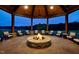 Stunning outdoor firepit surrounded by comfortable seating and lush landscaping, perfect for gatherings at 1309 Magnolia Gln Cir, Wake Forest, NC 27587