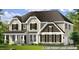 Charming two-story home with beautiful architectural details, complemented by a well-manicured lawn and a 3-car garage at 15 Celtic Ln, Lillington, NC 27546