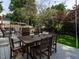 Backyard deck with an outdoor dining area and a view of the landscaped yard at 1510 Hanover St, Raleigh, NC 27608