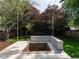 Backyard with a custom brick firepit and seating, perfect for outdoor gatherings at 1510 Hanover St, Raleigh, NC 27608