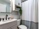 Bathroom with white marble countertop, modern fixtures and plenty of storage at 1510 Hanover St, Raleigh, NC 27608
