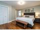 Bedroom features hardwood floors, closet space, and a view into another room at 1510 Hanover St, Raleigh, NC 27608
