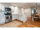 Bright kitchen with stainless appliances, subway tile backsplash, and an island with seating at 1510 Hanover St, Raleigh, NC 27608