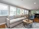 Bright living room with a comfortable sectional, lots of windows, and natural light at 1510 Hanover St, Raleigh, NC 27608