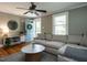 Comfortable living room with hardwood floors, a blue front door, and a stylish sectional sofa at 1510 Hanover St, Raleigh, NC 27608