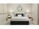 Serene bedroom with a comfortable bed, stylish lighting, and minimalist decor at 1552 Bright Coral Trl, Wendell, NC 27591