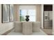 Modern dining room with stainless steel appliances, light wood table, upholstered chairs, and neutral tones at 1552 Bright Coral Trl, Wendell, NC 27591