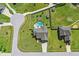 An aerial view of a home shows the pool, patio, and manicured backyard in this well kept neighborhood at 17 Kaki Ct, Selma, NC 27576