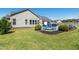 Manicured backyard featuring a pool, outdoor seating, and lush lawn perfect for recreation at 17 Kaki Ct, Selma, NC 27576