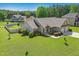 A lovely aerial view showcases the manicured front yard and well-maintained exterior of this delightful home at 17 Kaki Ct, Selma, NC 27576