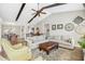 Spacious living area features vaulted ceilings, wood-look flooring, and comfortable seating arrangement at 17 Kaki Ct, Selma, NC 27576