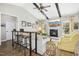 Cozy living room with vaulted ceiling, wooden beams, fireplace and comfortable seating at 17 Kaki Ct, Selma, NC 27576