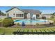 Inviting backyard pool with patio area, lush greenery, and well-maintained landscaping at 17 Kaki Ct, Selma, NC 27576